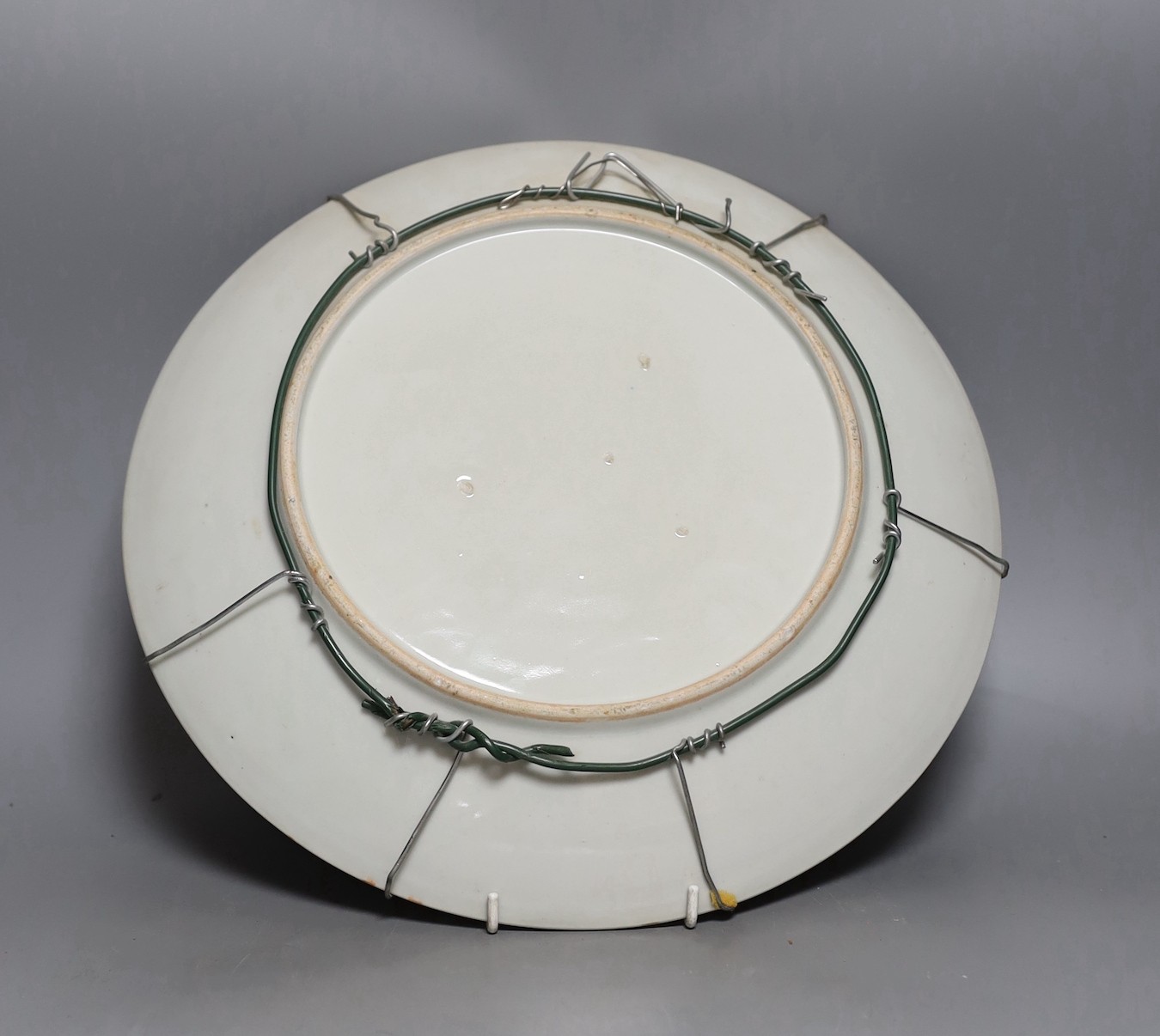 An early 20th century Japanese yellow ground dish with bird and floral decoration - 36.5cm diameter